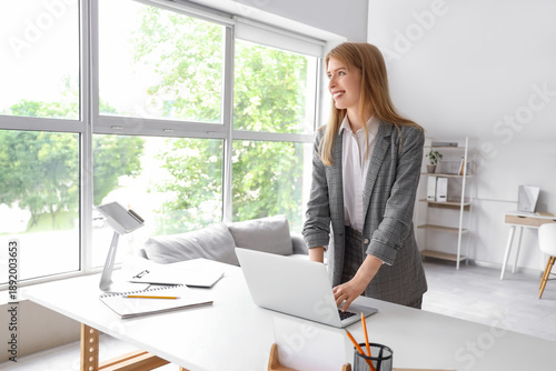 Young businesswoman working...