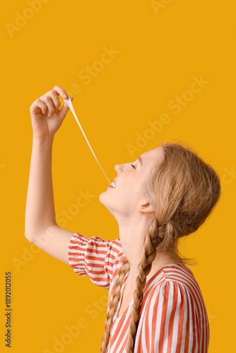 Teenage girl chewing gum on...