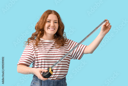 Young woman with measuring ...
