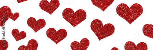 Many red, textured hearts scattered on black