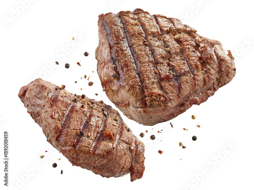 Φωτογραφία two grilled steaks with peppercorns, isolated on transparent background, restaurant quality meat, close-up shot