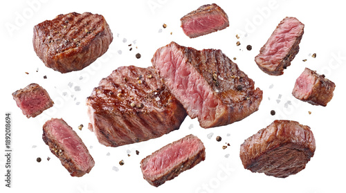 high-quality photograph of delicious grilled steak cuts with salt and pepper scattered on a transparent background, showcasing a savory culinary delight perfect for food blogs and restaurant menus.
