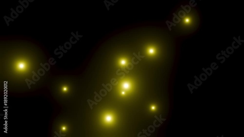 黒背景にゆっくり浮かび上がる黄色の粒子