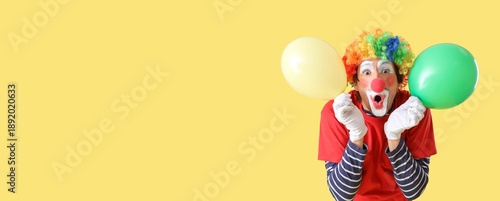 Surprised clown with balloo...
