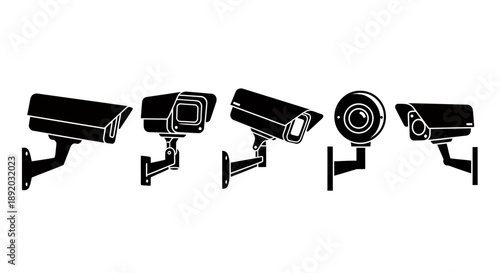 Four surveillance cameras mounted in a row illustrating modern security technology and monitoring capabilities.