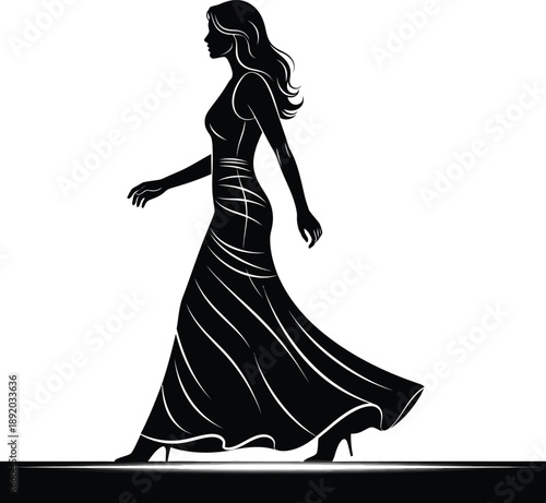 Elegant woman in flowing gown walking confidently on a runway