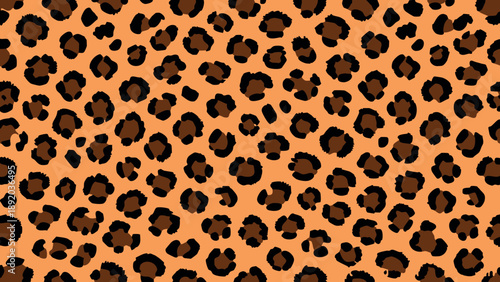 Leopard skin pattern design background with seamless animal print spots on warm tan surface