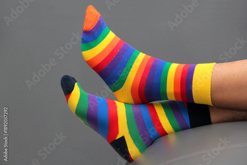 Foto Feet with mismatched socks, different colors and designs for World Down Syndrome
