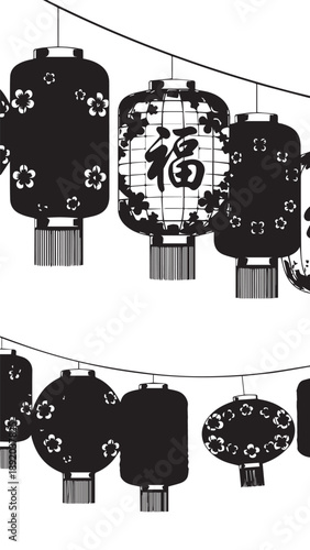 Decorative Chinese lanterns with 福 character hanging on festive string lights in a night display.