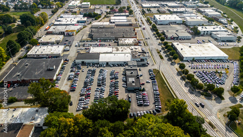 An aerial view of a car dealership parking lot in the Midwest