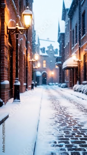 Wallpaper Mural Warm lights glow on a snow-covered brick street, buildings, and gently falling winter flakes Torontodigital.ca