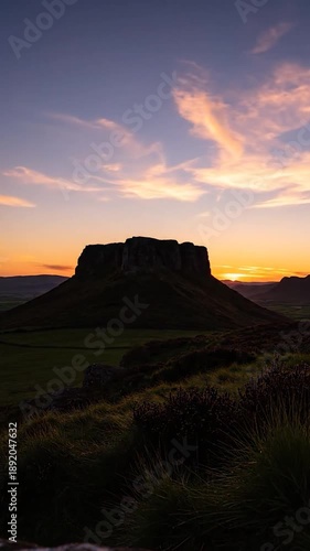 Wallpaper Mural Dramatic sunburst behind a flat-topped mountain silhouette, painting the sky in fiery hues Torontodigital.ca