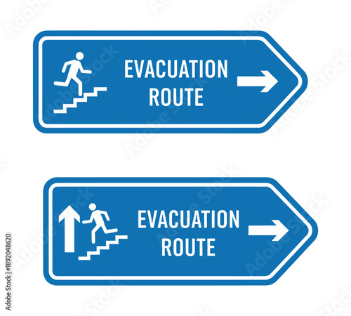 Two blue evacuation route signs with white text and icons, showing a person running up stairs and an arrow pointing right, indicating an emergency exit.