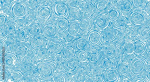 Abstract blue swirls and spirals create a repeating pattern background.
