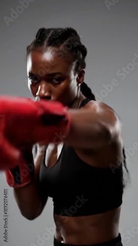 Wallpaper Mural Woman in black sportswear and red boxing gloves training Torontodigital.ca