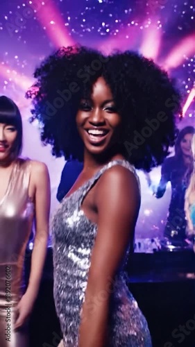 Wallpaper Mural Women in shimmering outfits dancing under vibrant disco lights Torontodigital.ca