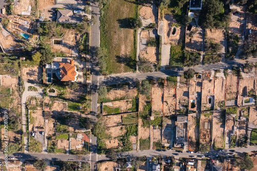 Quadro su tela Drone view of empty lots of homes left behind from the Eaton fire, Pacific Palisades