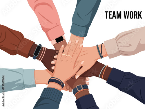 Diverse group of people stacking hands in a symbol of teamwork and unity