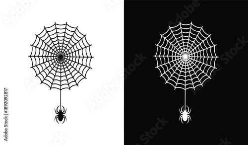 Black and white spider web with spider hanging down and