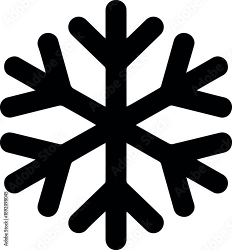 A muscular man drinking water from a bottle in a modern gym after an intense workout with fitness equipment around him