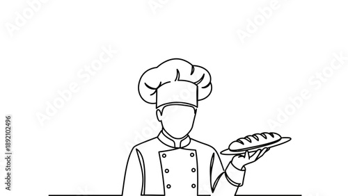 A chef in a uniform holding a plate of food in a kitchen