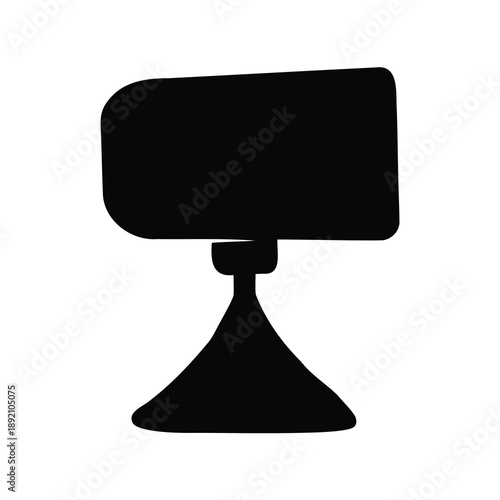 Silhouette of a modern desk lamp with a unique conical base design
