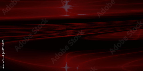 Abstract red light streaks and reflections on a dark background.