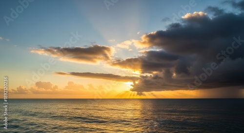 Wallpaper Mural Sunset over calm ocean with dramatic storm clouds and sun rays on horizon Torontodigital.ca