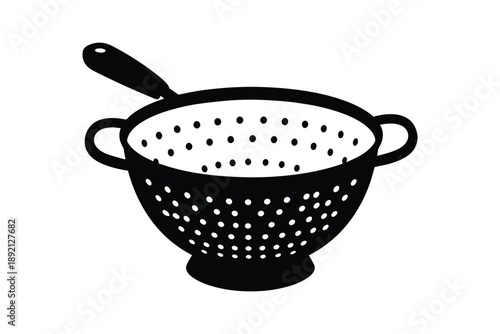 Black colander with holes for draining pasta and washing vegetables isolated on white