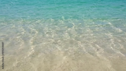 Abstract Water Surface Caustics Macro shot focusing purely on the intricate, ever-shifting light patterns created by gentle water movement on a submerged, featureless, and pristine surface, like an