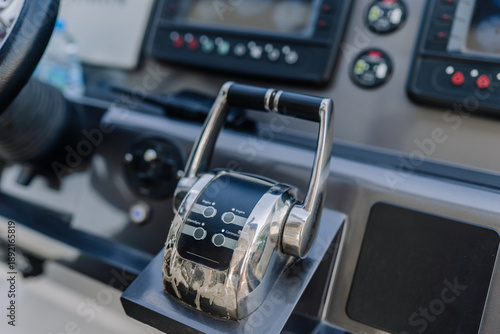 Tableau sur toile Boat throttle control lever with buttons and gauges in a modern marine dashboard