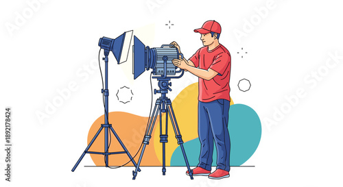 Professional technician in a red cap and shirt adjusting a large studio spotlight for a movie or photo shoot.