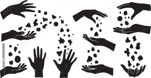 Silhouette of hands releasing shapes and symbols into air