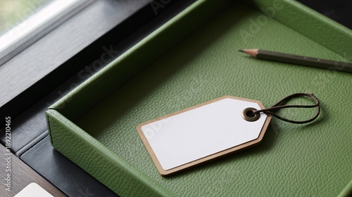 Wallpaper Mural Blank White Paper Tag with String and Pencil in Green Leather Tray label Torontodigital.ca