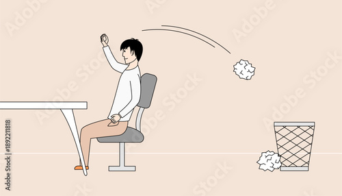 Man is sitting at a desk and throwing rubbish into the trash can