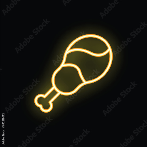 Bright yellow neon sign in the shape of a chicken drumstick is glowing on a black background
