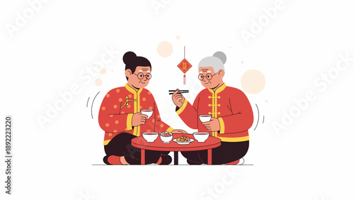 Two People In Red Traditional Attire At Table.