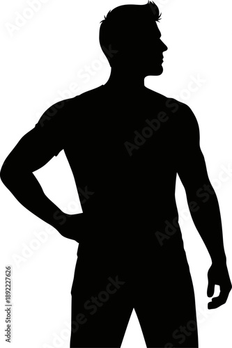 Silhouette of a man standing with one hand on hip