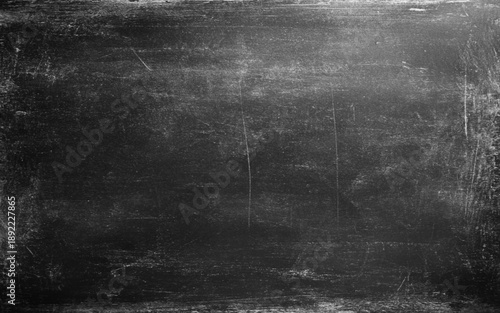 Chalk rubbed out on blackboard background. Black texture dark slate background. Beton concrete surface.