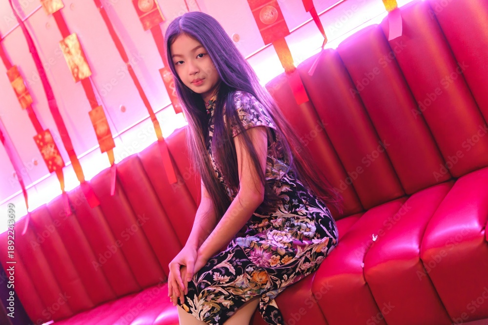 Fototapeta premium Young Girl in Traditional Dress Celebrating New Year Festivities