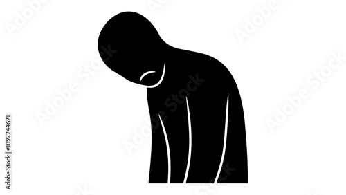 Person standing with head down in sorrow or shame