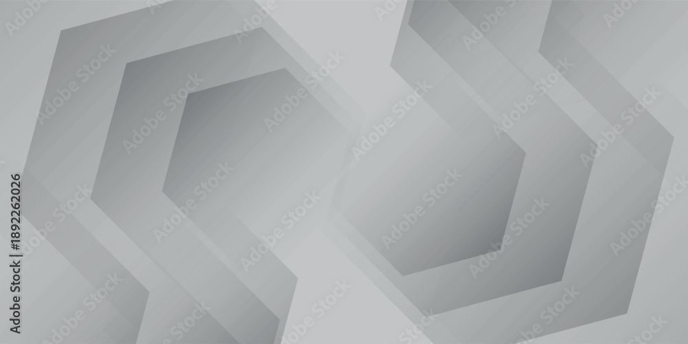 Fototapeta premium Abstract geometric pattern with repeating hexagonal shapes in shades of grey and white, creating a modern and minimalist background.