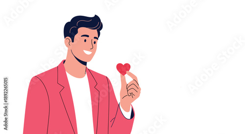 Charming young man in a pink jacket smiling warmly while holding a tiny red heart, symbolizing love, charity, or affection.