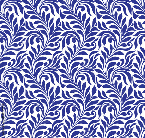 Vibrant blue and white floral repeating pattern featuring swirling leaves and intricate shapes, creating an elegant, modern design.