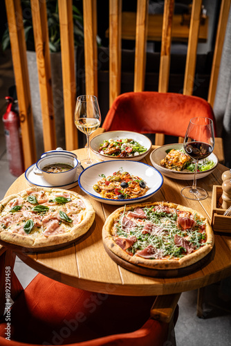 Italian Restaurant Table with Pizza and Wine