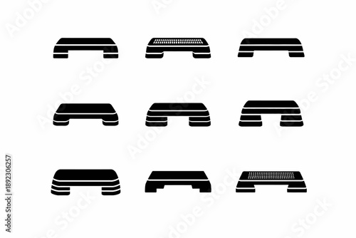 Set of nine black silhouette aerobic step platforms on white background