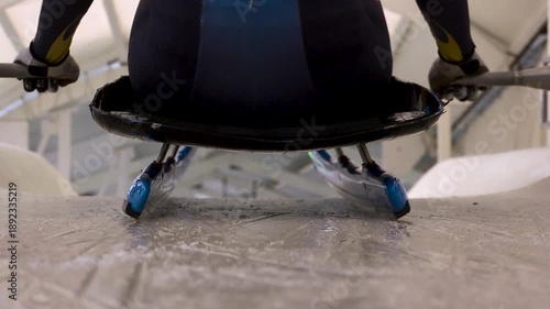 Luge athlete and sled at the starting line