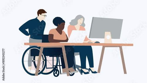 Diverse team collaborating on laptop at modern workspace with wheelchair accessibility