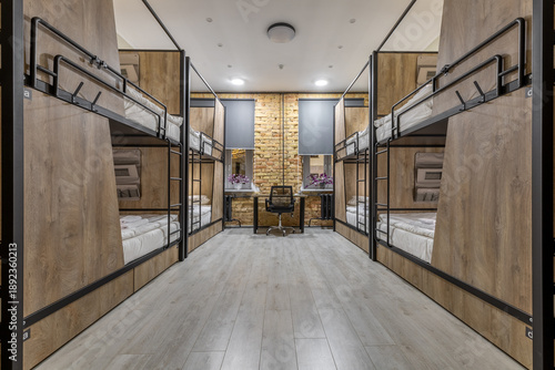 Photos Symmetrical loft hostel dormitory with bunk beds and night city view