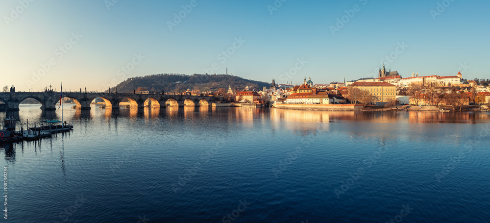 Fototapeta premium Cityscape panorama of Prague with Charles Bridge over Vltava River, beautiful buildings of Mala Strana and Hradcany Castle in morning light, Czech Republic